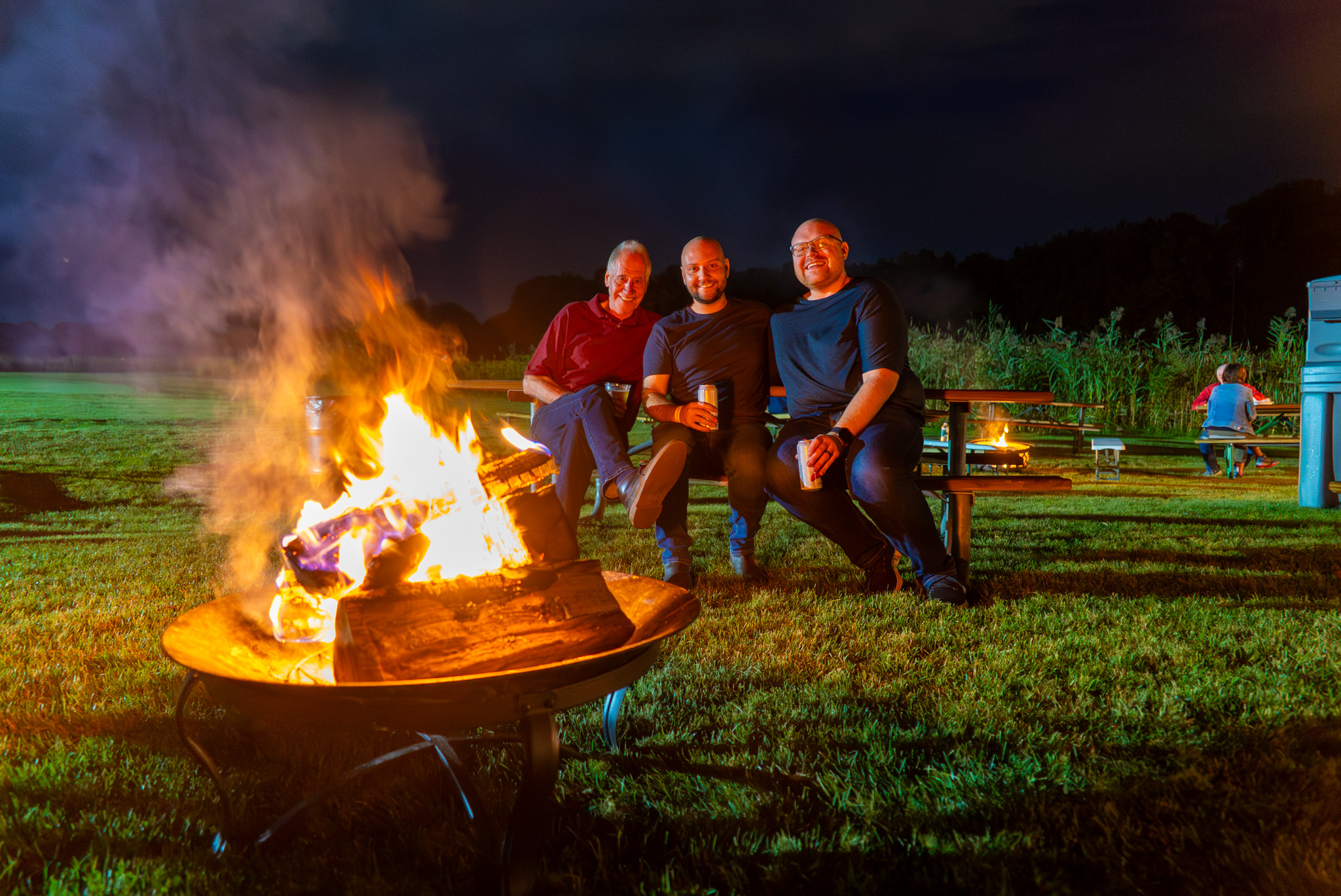 Three men by fire pit at Bonfire & Brews event. Photo courtesy of Gurnee Park District.
